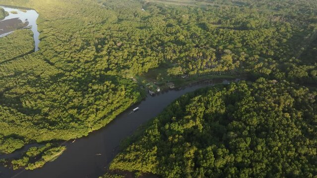 Mangroves with local boats in early morning in El paredon Guatemala - Drone shot