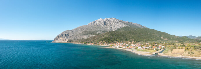 The town on the rocky coast in the middle of green countryside , Europe, Greece, Aetolia Acarnania,...