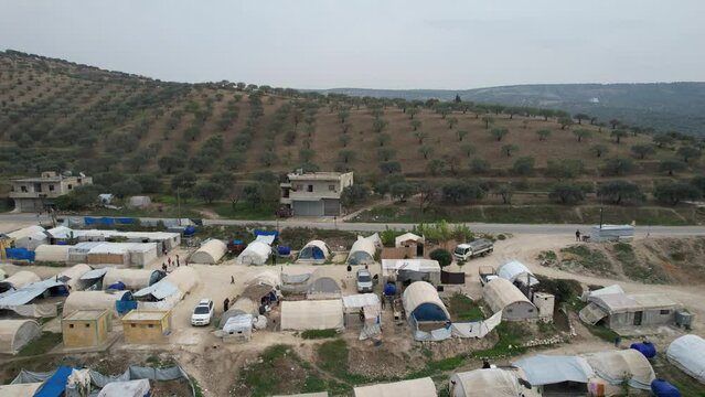 Aerial view of hundreds of tents inhabited by Syrian refugees for years due to the war that destroyed their homes.	