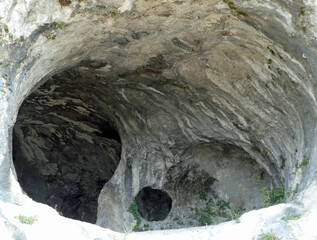 caves dug inside the rocky mountain used in the prehistoric era by primitive men as shelter and...