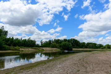 Loire river in the middle of green countryside in Europe, France, Burgundy, Nievre, Pouilly sur Loire, towards Nevers, in summer, on a sunny day.