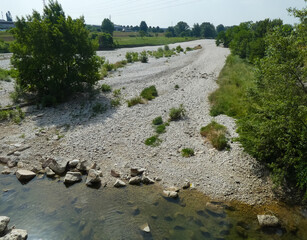 river bed with little water due to the summer drought without people