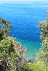 view from the top of the rock of the coast and the beautiful blue Mediterranean sea in summer without people