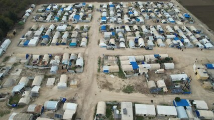 Aerial view of hundreds of tents inhabited by Syrian refugees for years due to the war that destroyed their homes.	