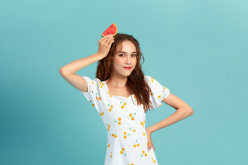 Beautiful young woman with watermelon on blue background. panorama