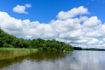 Lac des Settons amidst its green countryside in Europe, France, Burgundy, Nievre, towards Chateau Chinon, in summer on a sunny day.