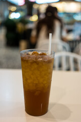 Close up glass of longan juice on table.