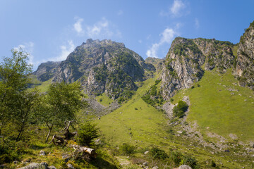 The mountains in the green countryside , Europe, France, Occitanie, Hautes-Pyrenees, in summer on a sunny day.