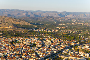 A panoramic view of the city center and arid countryside , Europe, Greece, Peloponnese, Argolis, Nafplion, Myrto seaside, in summer on a sunny day.