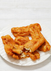 deep fried crispy beer batter fish fillet on plate