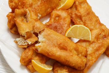 deep fried crispy beer batter fish fillet on plate