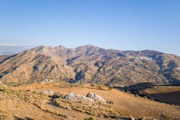 The rocky mountains , in Europe, in Greece, in Crete, towards Rethymno, By the Mediterranean sea, in summer, on a sunny day.