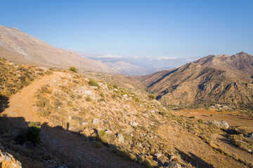 The rocky mountains , in Europe, in Greece, in Crete, towards Rethymno, By the Mediterranean sea, in summer, on a sunny day.