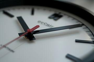 clock with hands moving counterclockwise, symbolizing the backward movement of emissions over time in a minimalistic photo