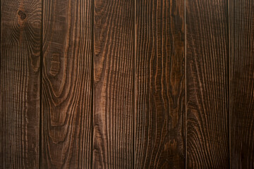 Texture of dark brown wooden vertical boards