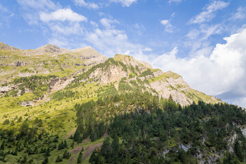 The barren rocky mountains in the middle of the countryside , Europe, France, Occitanie,...