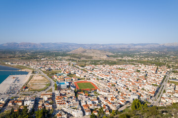A panoramic view of the city center and arid countryside , Europe, Greece, Peloponnese, Argolis, Nafplion, Myrto seaside, in summer on a sunny day.