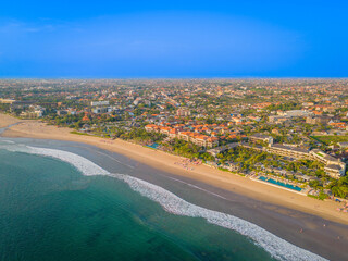 Aerial view of Seminyak beach coastline. The famous and luxury Kuta beach resort in southern Bali,...