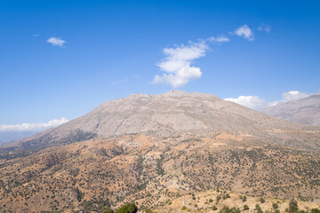 The arid countryside in the south of the island , in Europe, Greece, Crete, towards Preveli, By the Mediterranean sea, in summer, on a sunny day.