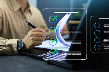 Document approval concept with businessman hand with pen working with paper document on office desktop to check and approved on working process