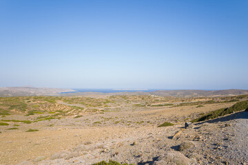 The arid countryside among the mountains , in Europe, Greece, Crete, towards Sitia, By the Mediterranean sea, in summer, on a sunny day.