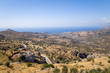 Fototapeta na wymiar The arid countryside in the south of the island , in Europe, Greece, Crete, towards Preveli, By the Mediterranean sea, in summer, on a sunny day.