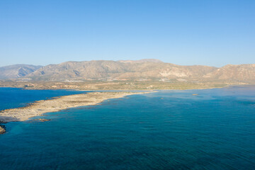 The sandy beach and its heavenly colored water, in Europe, Greece, Crete, Elafonisi, By the Mediterranean Sea, in summer, on a sunny day.