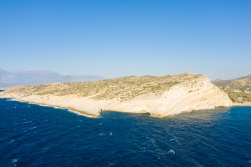 The caves in the rocky and limestone cliffs , in Europe, Greece, Crete, Matala, By the Mediterranean Sea, in summer, on a sunny day.