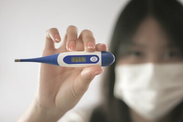 Pictures of women checking fever with temperature measurement.concept photo of health care.
