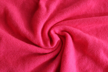 Beautiful pink fabric as background, top view