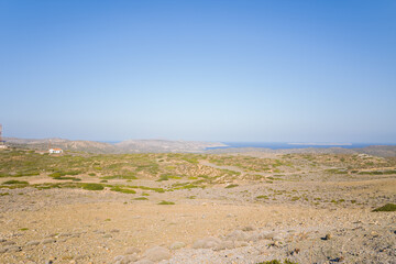 The arid countryside among the mountains , in Europe, Greece, Crete, towards Sitia, By the Mediterranean sea, in summer, on a sunny day.