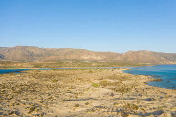 The nature reserve and its fine white sand, in Europe, Greece, Crete, Elafonisi, By the Mediterranean Sea, in summer, on a sunny day.