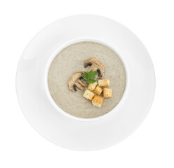 Delicious mushroom cream soup with croutons in bowl isolated on white, top view
