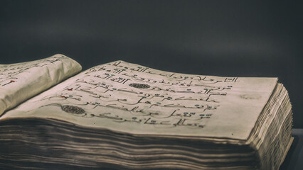 Ancient open book manuscript (verses of Koran Book, Holy Islamic Text). XII-XIII-th century arabic...