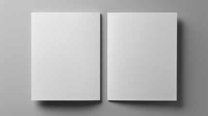  a white book opened on top of a gray surface with a shadow on the bottom of the book and a shadow on the top of the bottom of the book.