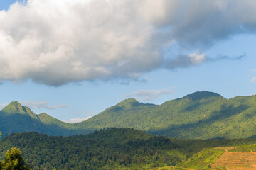 The green mountains in the tropical countryside, Asia, Vietnam, Tonkin, Dien Bien Phu, in summer, on a sunny day.