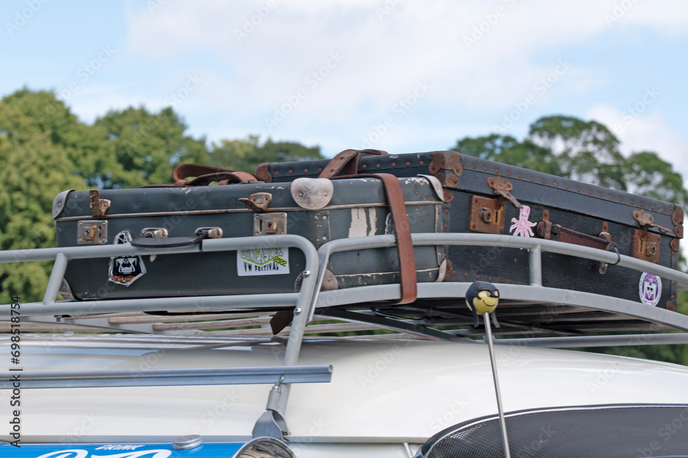 Wall mural vintage vehicle roof rack with suitcases