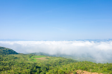Fototapeta na wymiar The clouds above the city seen from the green mountains , in Asia, Vietnam, Tonkin, Dien Bien Phu, in summer, on a sunny day.