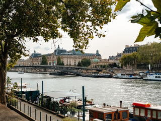 The Seine embankment in the center of Paris. View of the Orsay Museum (Musée d'Orsay) - obrazy, fototapety, plakaty