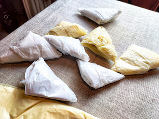 Plastic bag folded into a triangle for storage. Ways of storing and laying at home