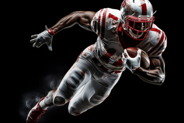 Portrait of American football player running with the ball. Muscular athlete in a white and red uniform with an ovoid ball in a dynamic pose. Isolated on black background.