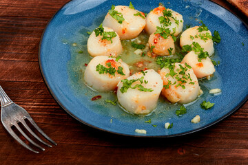 Scallops seared in garlic