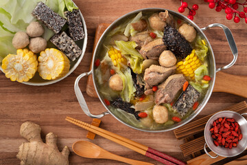 Delicious ginger duck hot pot soup with fresh vegetables in Taiwan. - obrazy, fototapety, plakaty