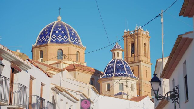 Altea is a little sea village city with white houses in Mediterranean coast called the Costa Blanca, Spain. Spanish city of Altea in the city center on the mountain church with a blue roof