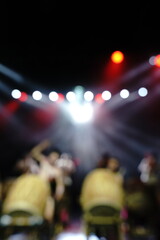 Defocused entertainment concert lighting on stage, blurred disco party and Concert Live.