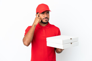 pizza delivery man picking up pizza boxes isolated on white background having doubts and thinking