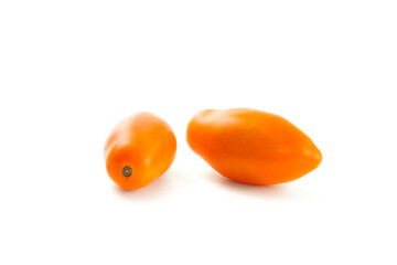 Two yellow tomatoes isolated on white background with clipping path. .
