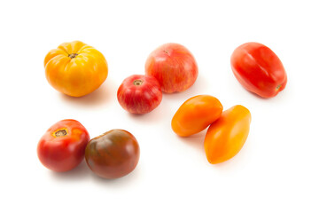 Assort of different shape and color tomatoes isolated on white background with clipping path. .