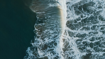 Aerial Top View Drone Footage Of Ocean Waves Reaching Shore