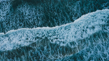 Aerial Top View Drone Footage Of Ocean Waves Reaching Shore